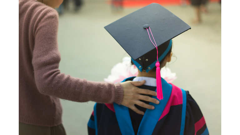 Kindergarten graduate, mom and child