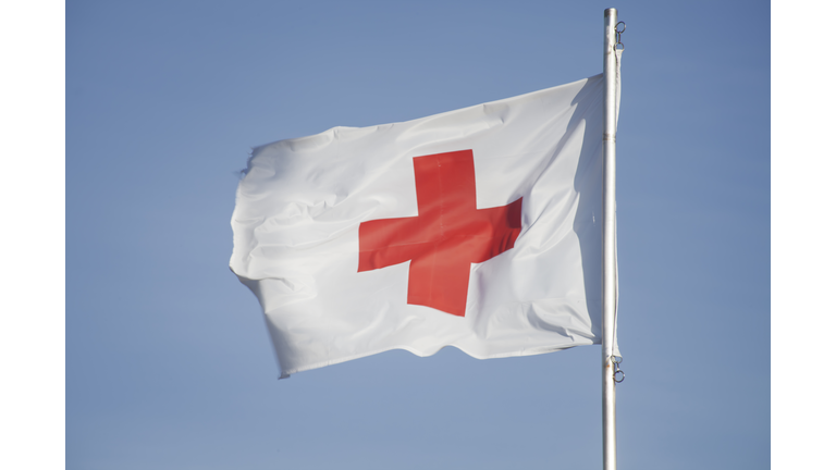 First Aid/Medic Red cross flag and blue sky.
