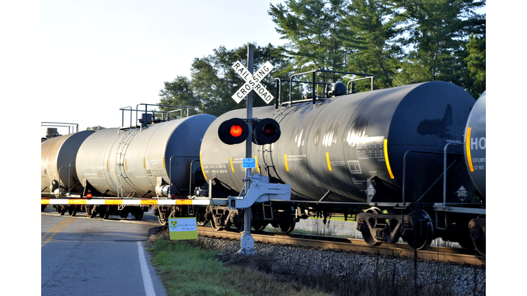 Railroad Tanker Cars at railway crossing.