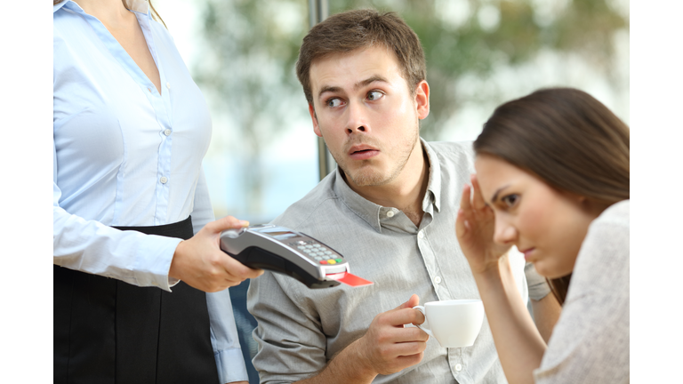 Boyfriend looking at waiter chest