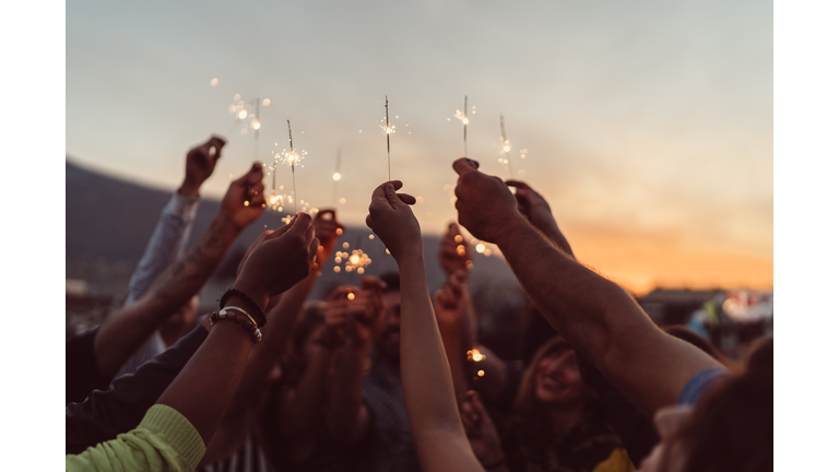 Friends celebrating New Year on the rooftop