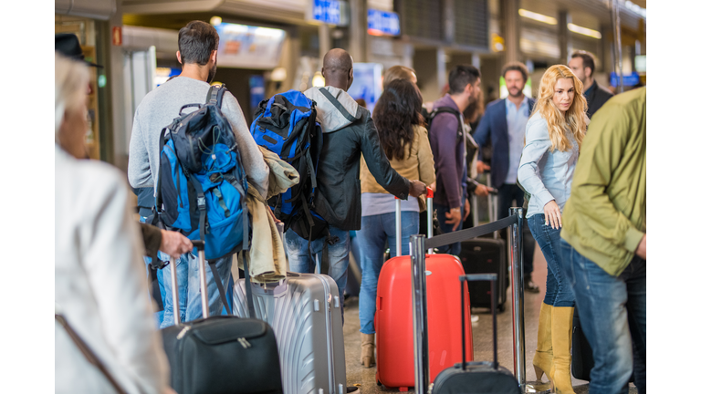 Business people standing in queue at airport