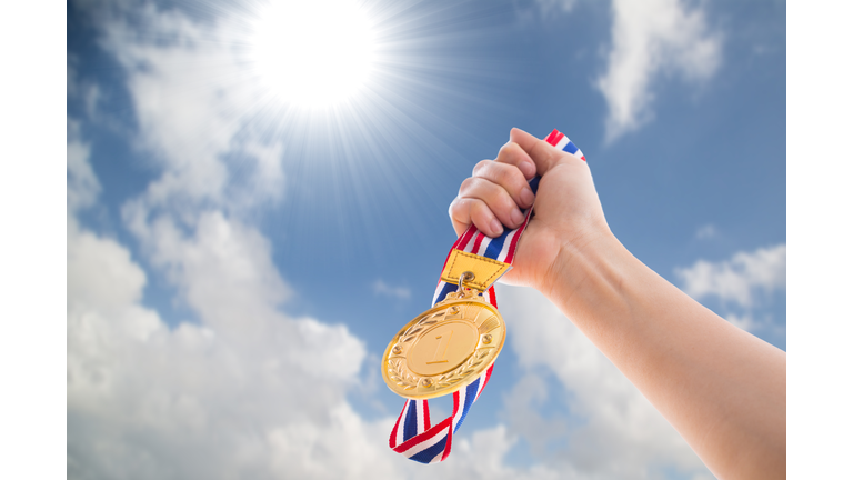 The winner holding golden medal