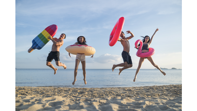 Happy young people on the beach having fun