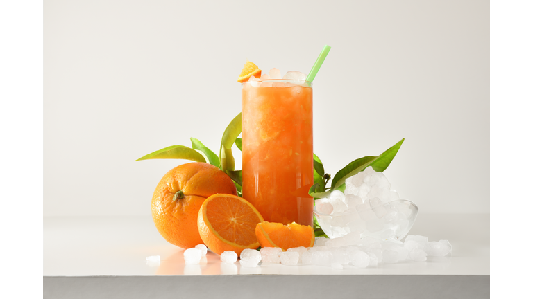 Orange slushie with fruit and ice and isolated background