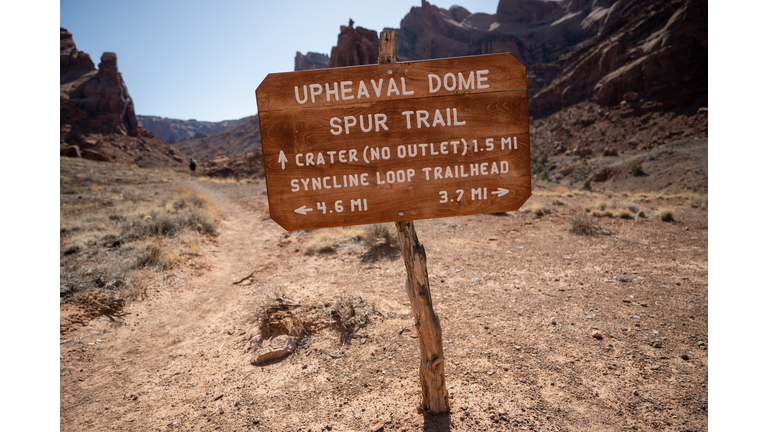 Upheaval Dome Sign Points Hikers
