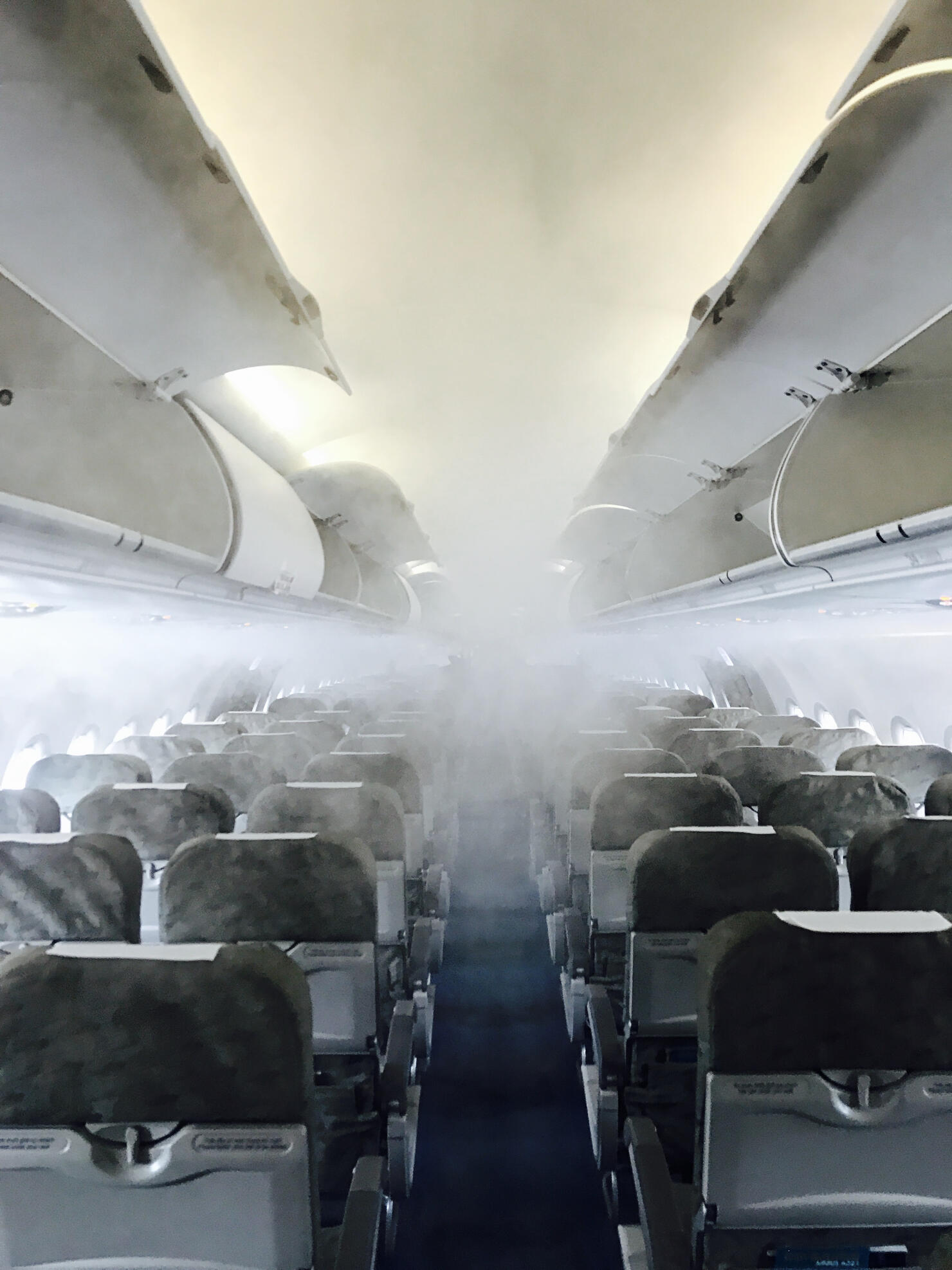 Inside of an airplane full of fog