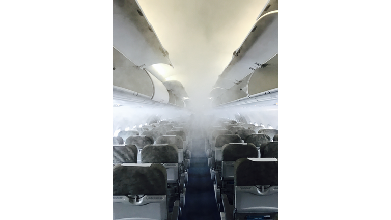 Inside of an airplane full of fog