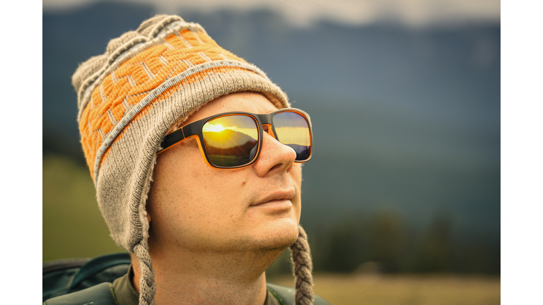 Portrait of a tourist in a hat and glasses