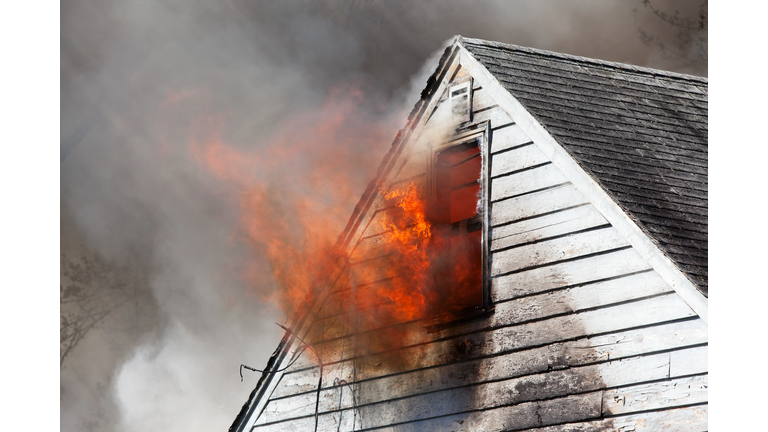 House Fire with Flames through Attic Window