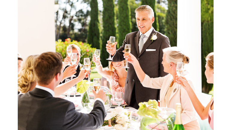 Father Of  The Bride Toasting Champagne At Wedding