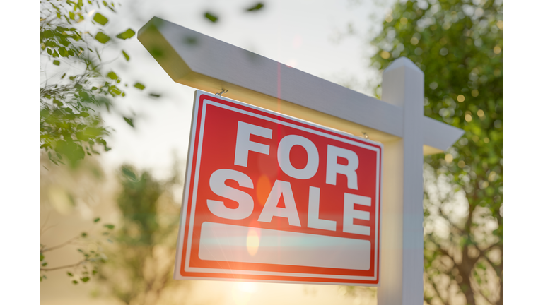 For Sale Real Estate Sign In Front of Property.