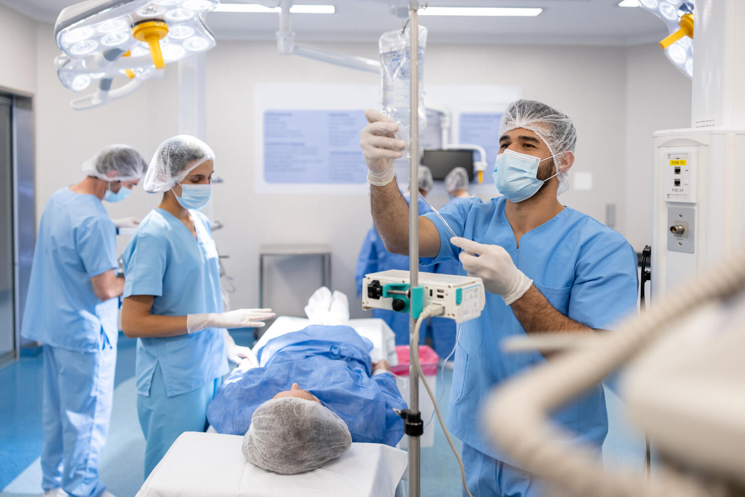 Doctors preparing a patient for a medical procedure