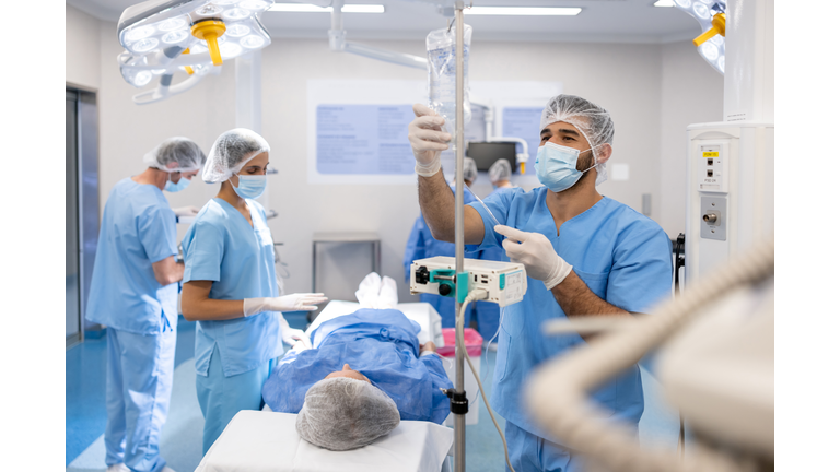 Doctors preparing a patient for a medical procedure