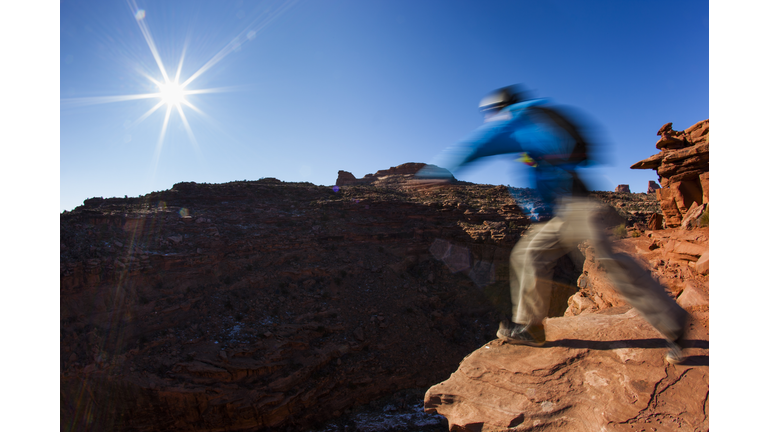 A person about to jump off a cliff.