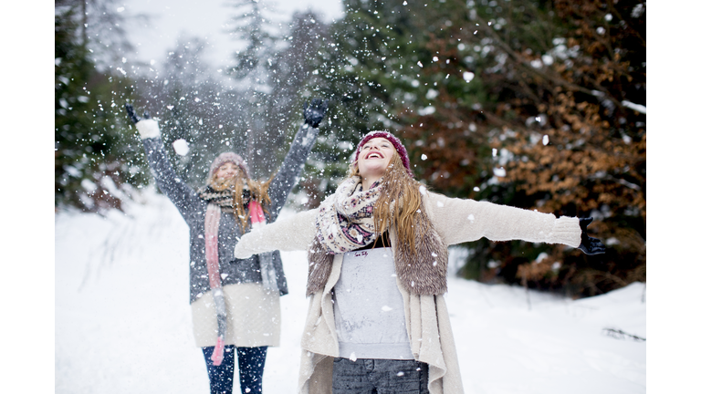 Sisters having fun in snow