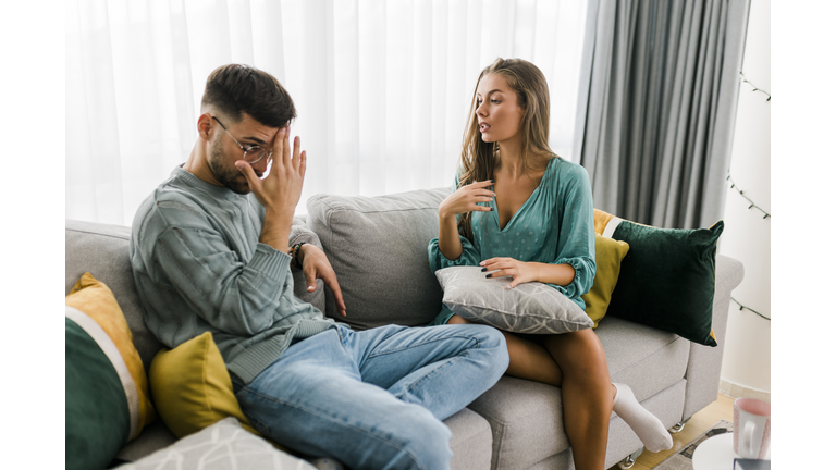 Shot of a young couple having an argument at home