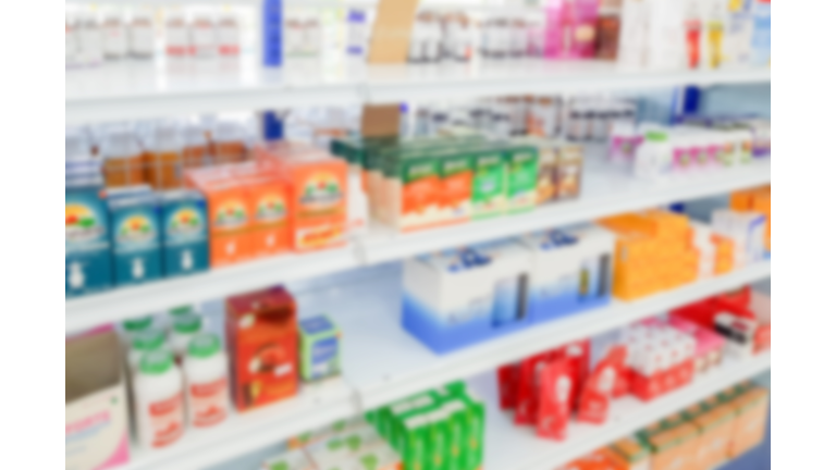 Pharmacy drugstore blur abstract backbround with medicine and healthcare product on shelves