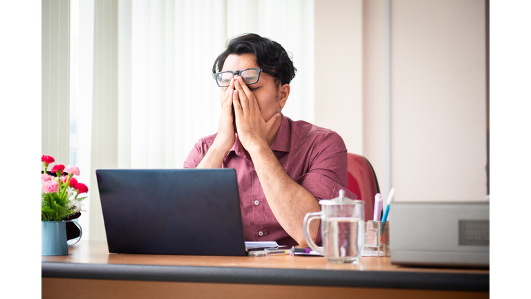 Office Worker Working Late and Looking Stress