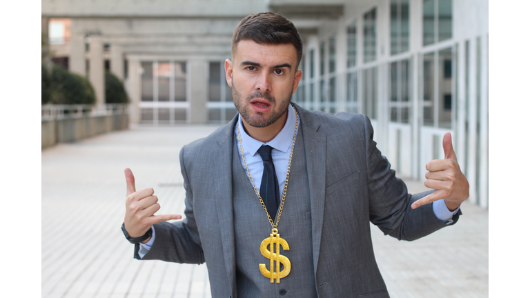 Businessman rocking golden necklace with dollar sign