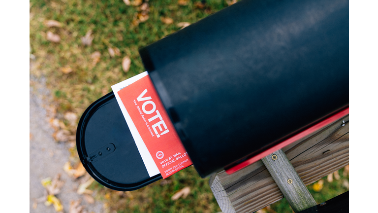 Suburban mailbox with a mail-in ballot to vote in the United States Presidential, Senatorial, Congressional, or local election