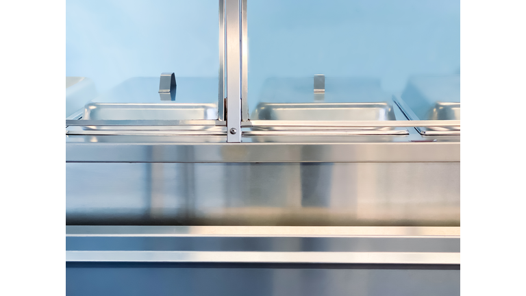 empty school cafeteria serving line