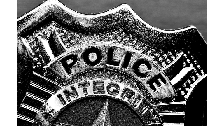 Police badge partial view