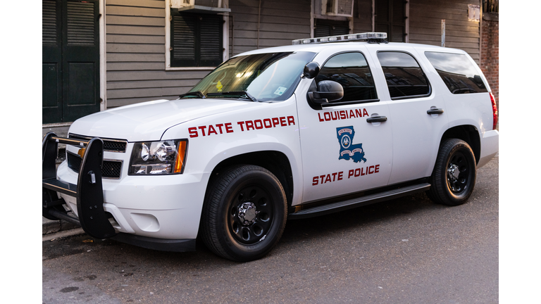 Louisiana State trooper police car parked on street road of French quarter