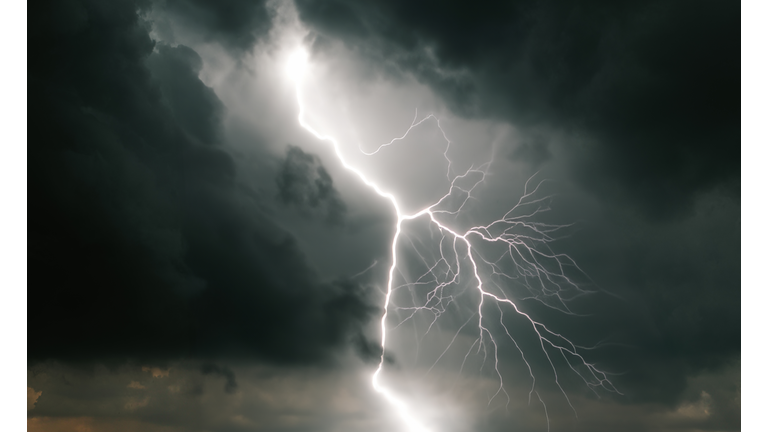 Forked lightning in a dark, ominous, cloudy sky