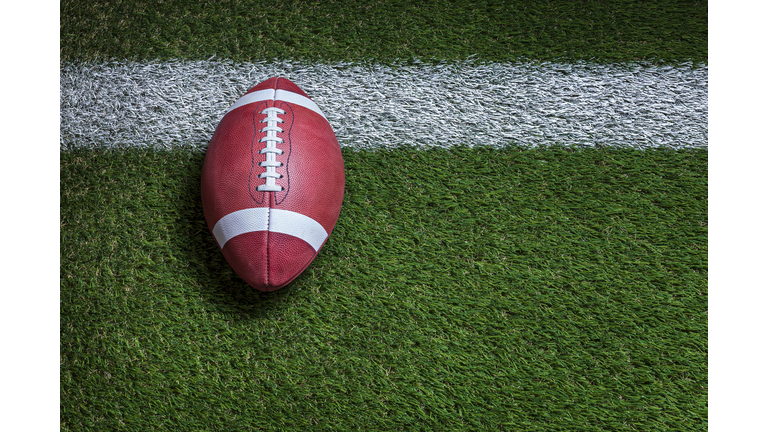 Football at the goal line on a grass field overhead view