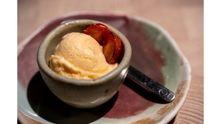 Shoyu icecreme with crispy sugar burning on tomato