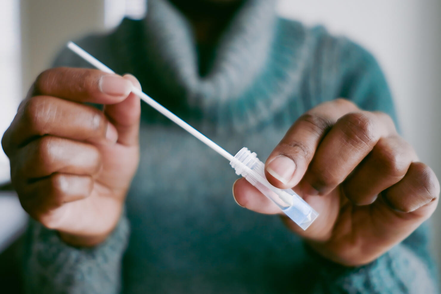 Woman Takes At-Home COVID Test