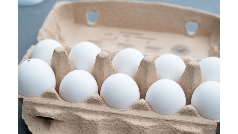 Carton full of white eggs.