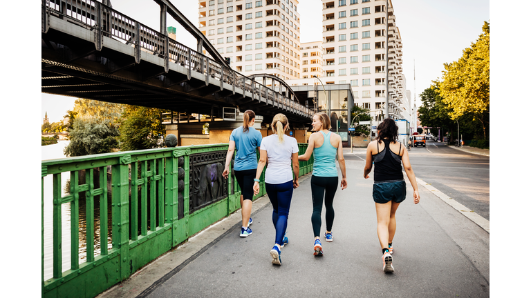 Fitness Group Cooling Down After City Run