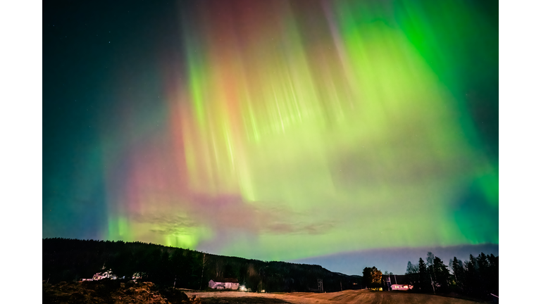 Colourful Aurora Borealis dancing over the sky