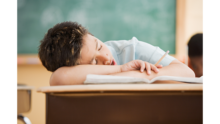 Boy sleeping on desk