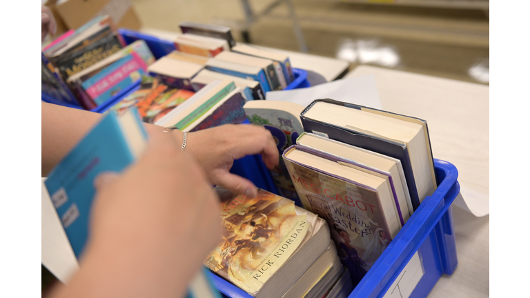 Elementary School Officials At A Public School In NYC Gather To Handout Year End Material To Students