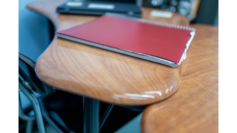 student notebook on desk in classroom