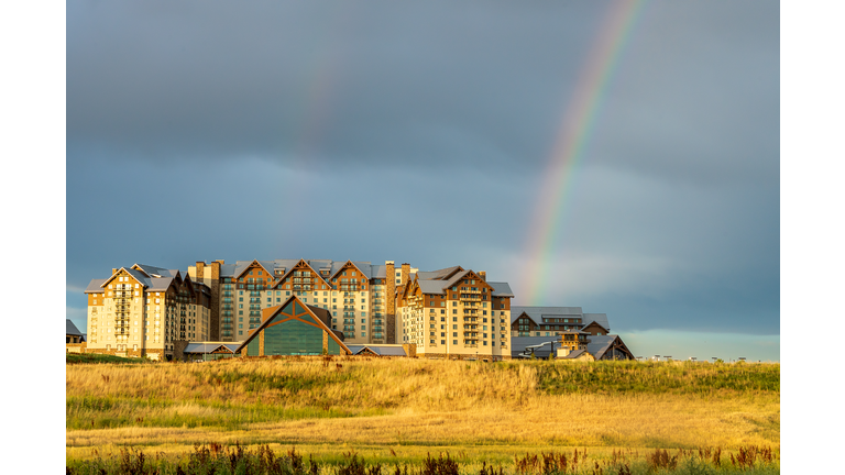 The stormy sky and rainbow above the new Gaylord Rockies Resort and Convention Center in Denver, Colorado