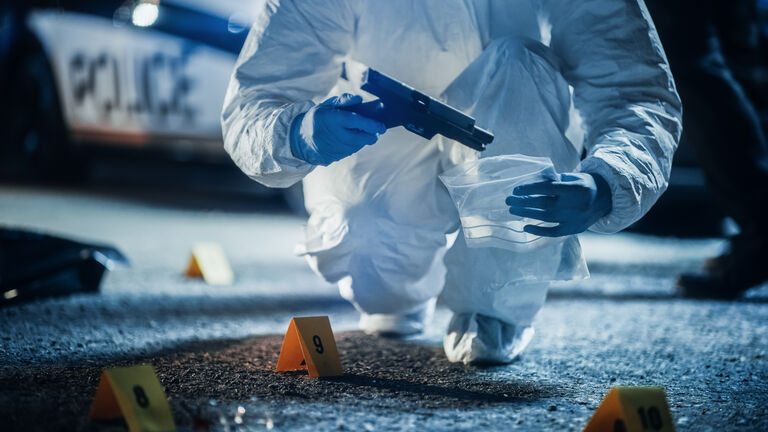 Police Find Murder Weapon in a Drug Deal Gone Wrong in a Night Case. Professional Forensics Making Sure the Evidence is not Cross Contaminated. Handgun Being Sent to Lab to Identify Fingerprints