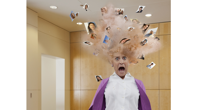 Head of businesswoman exploding with images of faces