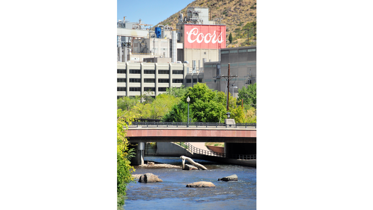 Coors brewery and Washington Avenue bridge over Clear Creek, the source of its water, Golden, Colorado, USA