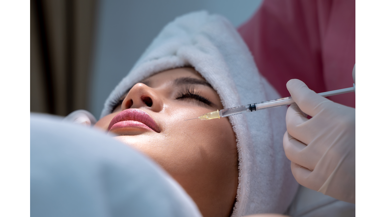 Young woman has a Botox injections,Cosmetology and skin care,Plastic surgery clinic.