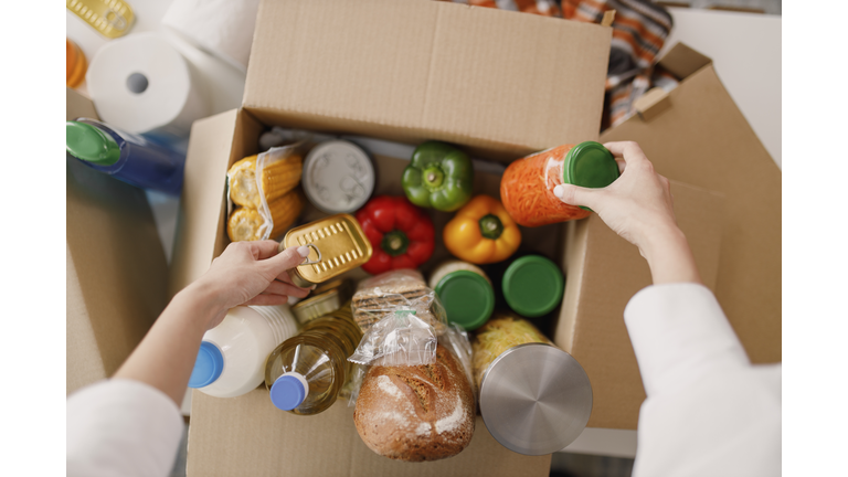 Details of Volunteer with box of food for poor