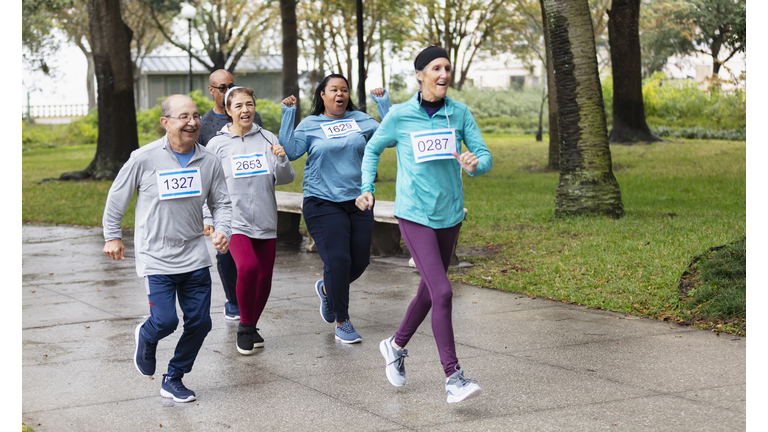 Multiracial mature and senior adults running in race