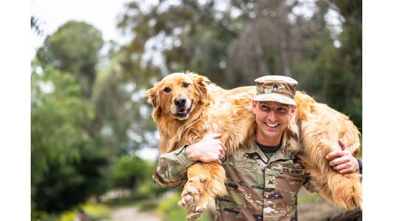 US Army Veteran Reunites with his Golden Retriever Dog Carrying on shoulders