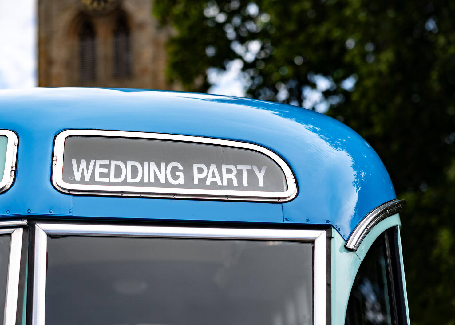 Wedding party bus coach transportation blue old vehicle to transport guests to church