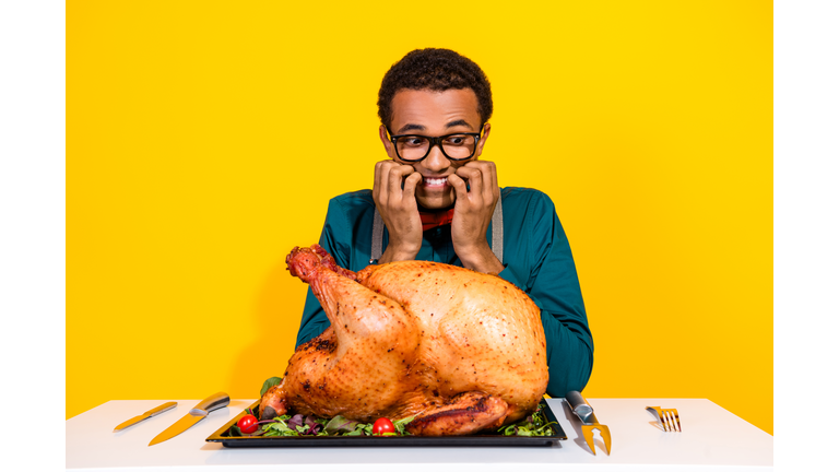 Photo of funky guy sit table bite fingers cant wait eat thanksgiving day turkey isolated bright color background