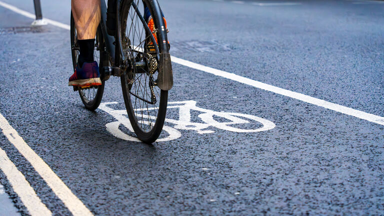 Cyclist riding in a bike lane in the city