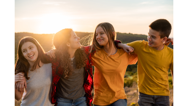 Group of happy teenagers in nature